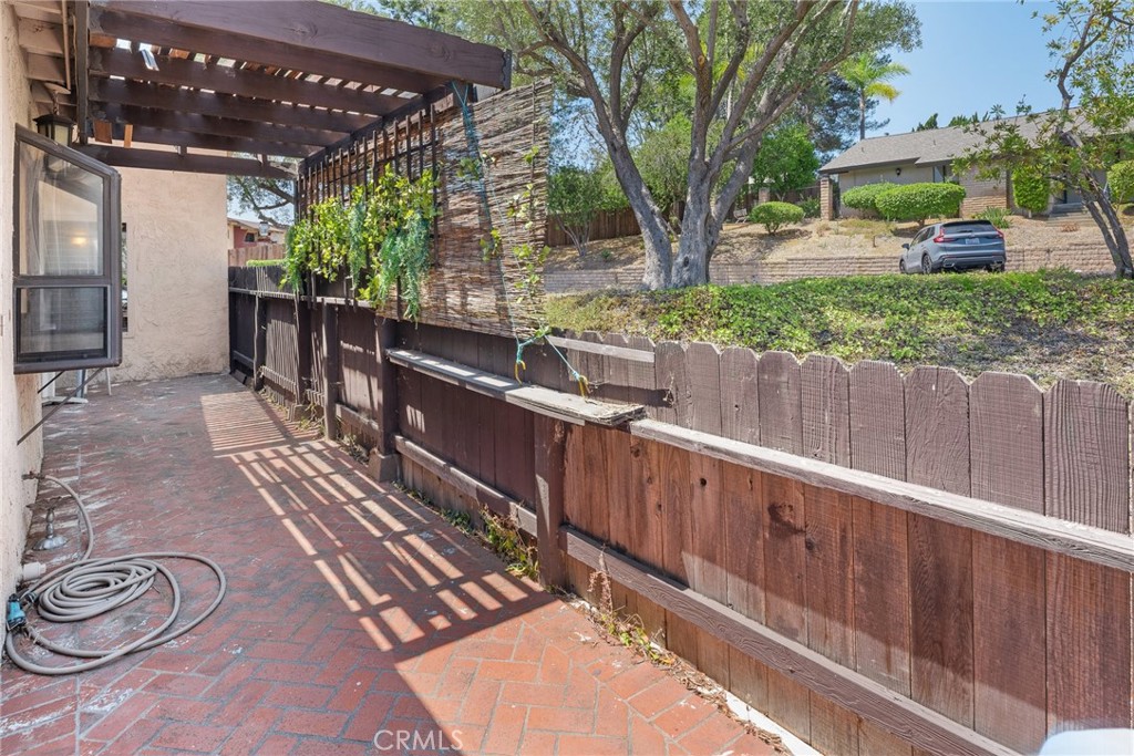 1400 Market Street Vista, CA 92084 - Photo 27 of 31 a view of a backyard with wooden fence