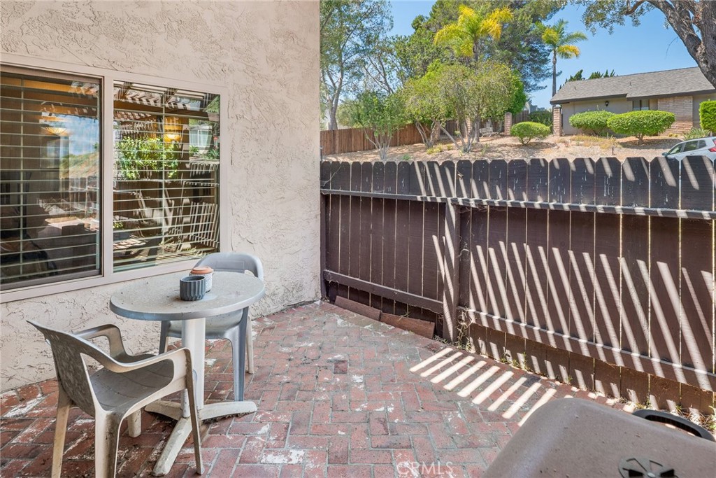 1400 Market Street Vista, CA 92084 - Photo 28 of 31 a backyard of a house with table and chairs