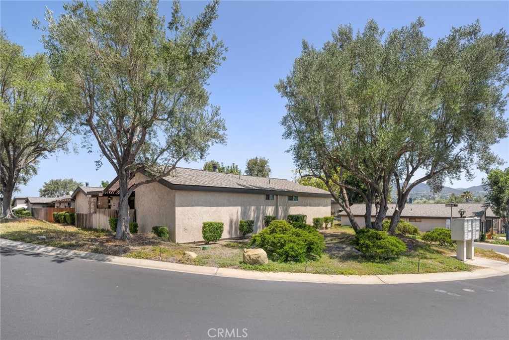 1400 Market Street Vista, CA 92084 - Photo 29 of 31 a front view of a house with a yard and potted plants