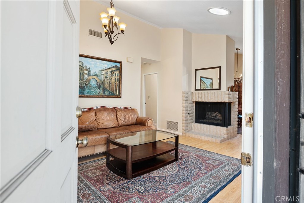 1400 Market Street Vista, CA 92084 - Photo 4 of 31 a living room with furniture and a fireplace