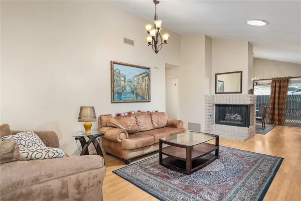 a living room with furniture and a rug