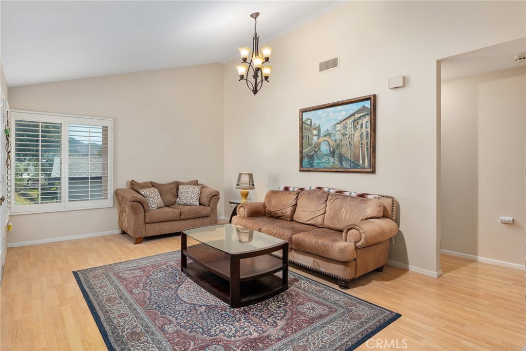 1400 Market Street Vista, CA 92084 - Photo 6 of 31 a living room with furniture and a rug