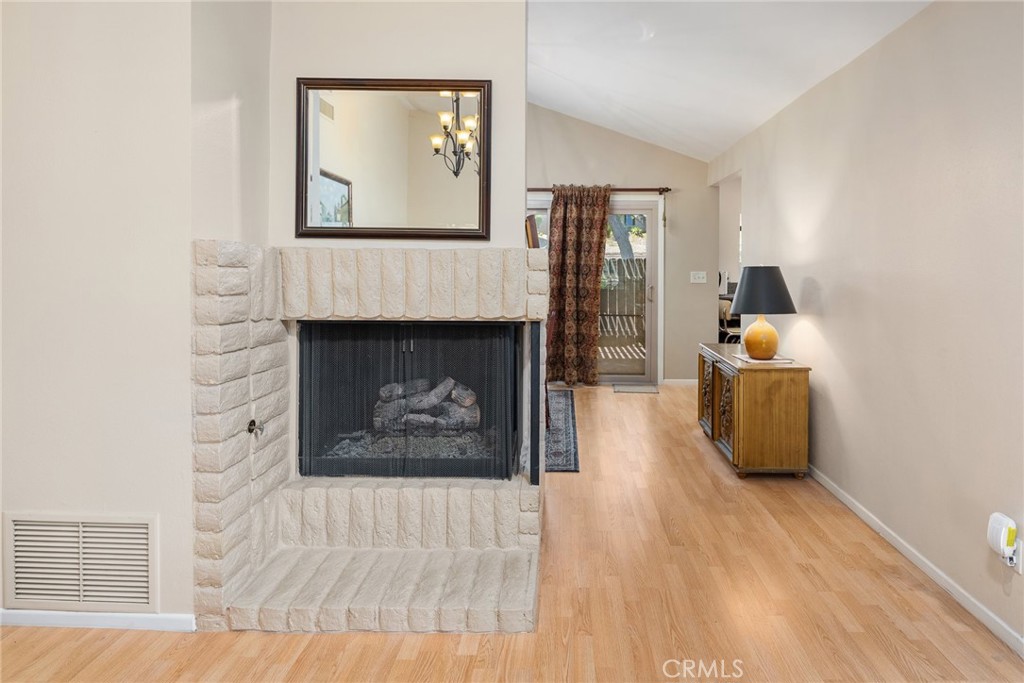 1400 Market Street Vista, CA 92084 - Photo 9 of 31 a living room with furniture and a fireplace