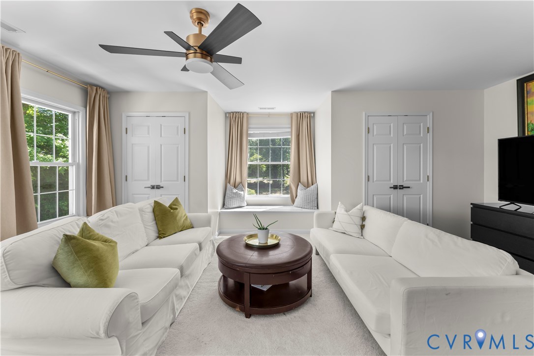 437 Plainview Road Kinsale, VA 22488 - Photo 52 of 63 a living room with furniture and a large window