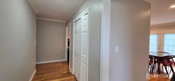 a view of a hallway with furniture