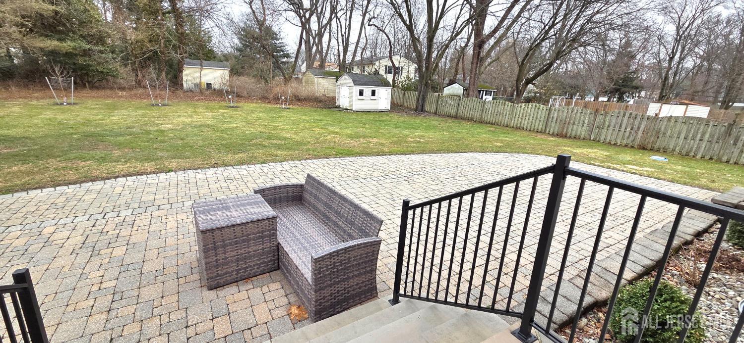 22 Oakbranch Road Cranbury, NJ 08512 - Photo 15 of 20 a view of a backyard with wooden fence