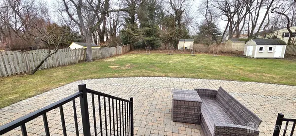 a view of a backyard with trees