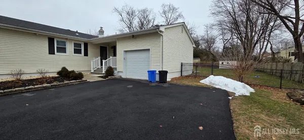 a view of backyard of house with outdoor seating
