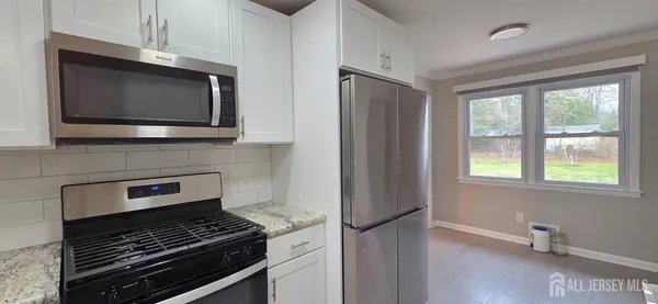 a kitchen with a stove and a microwave