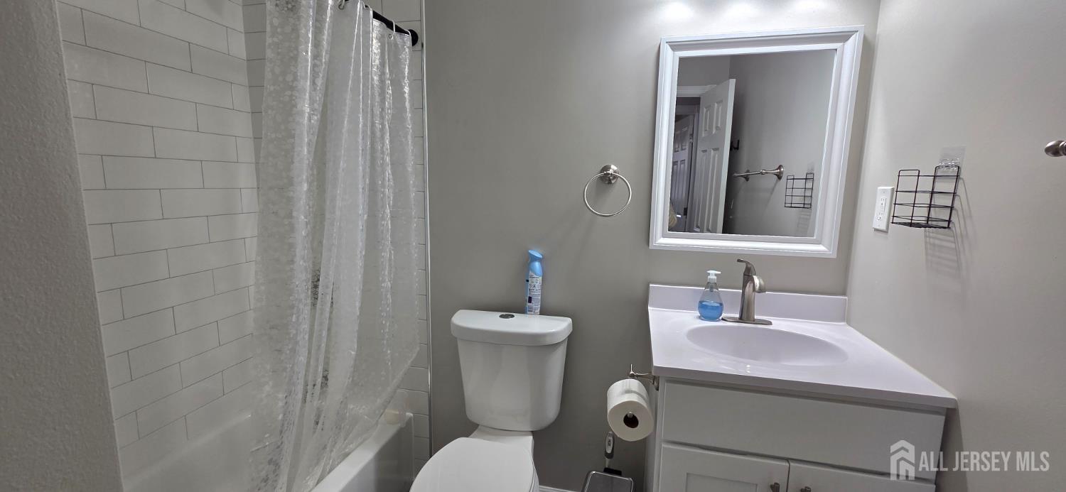 22 Oakbranch Road Cranbury, NJ 08512 - Photo 10 of 20 a bathroom with a toilet sink vanity and mirror