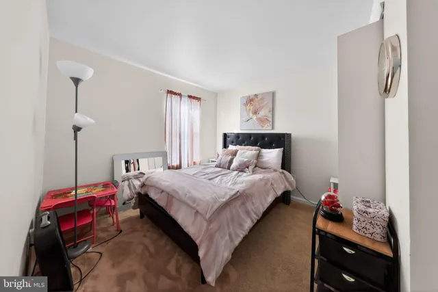 a bedroom with a bed and a closet