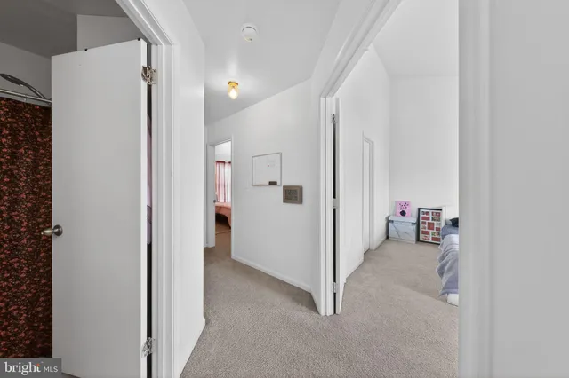 a view of a hallway with closet and outdoor space