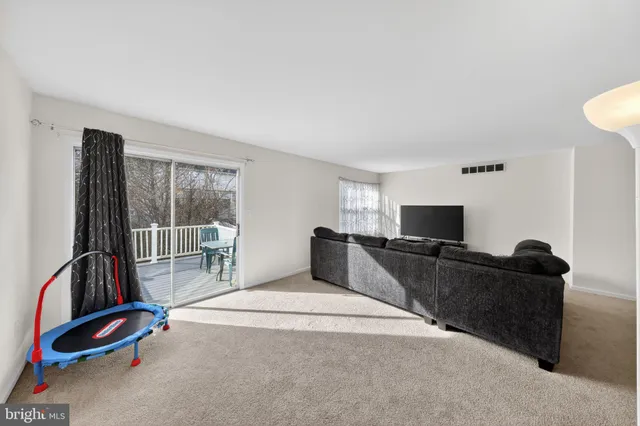 a bedroom with furniture and a flat screen tv
