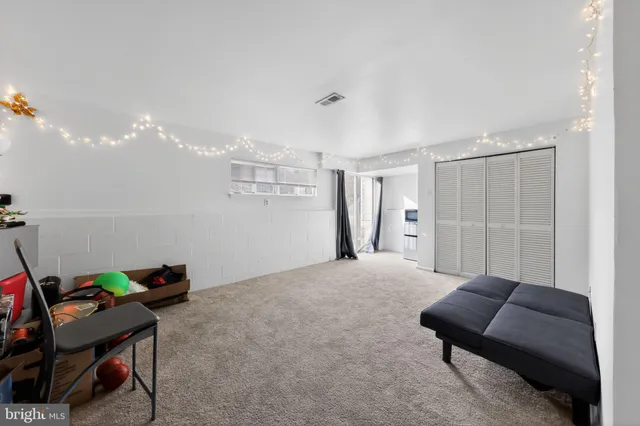 a bedroom with furniture and a chair