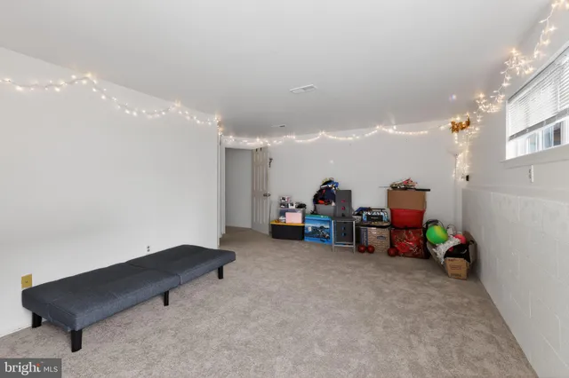 a view of a room with furniture and a garage