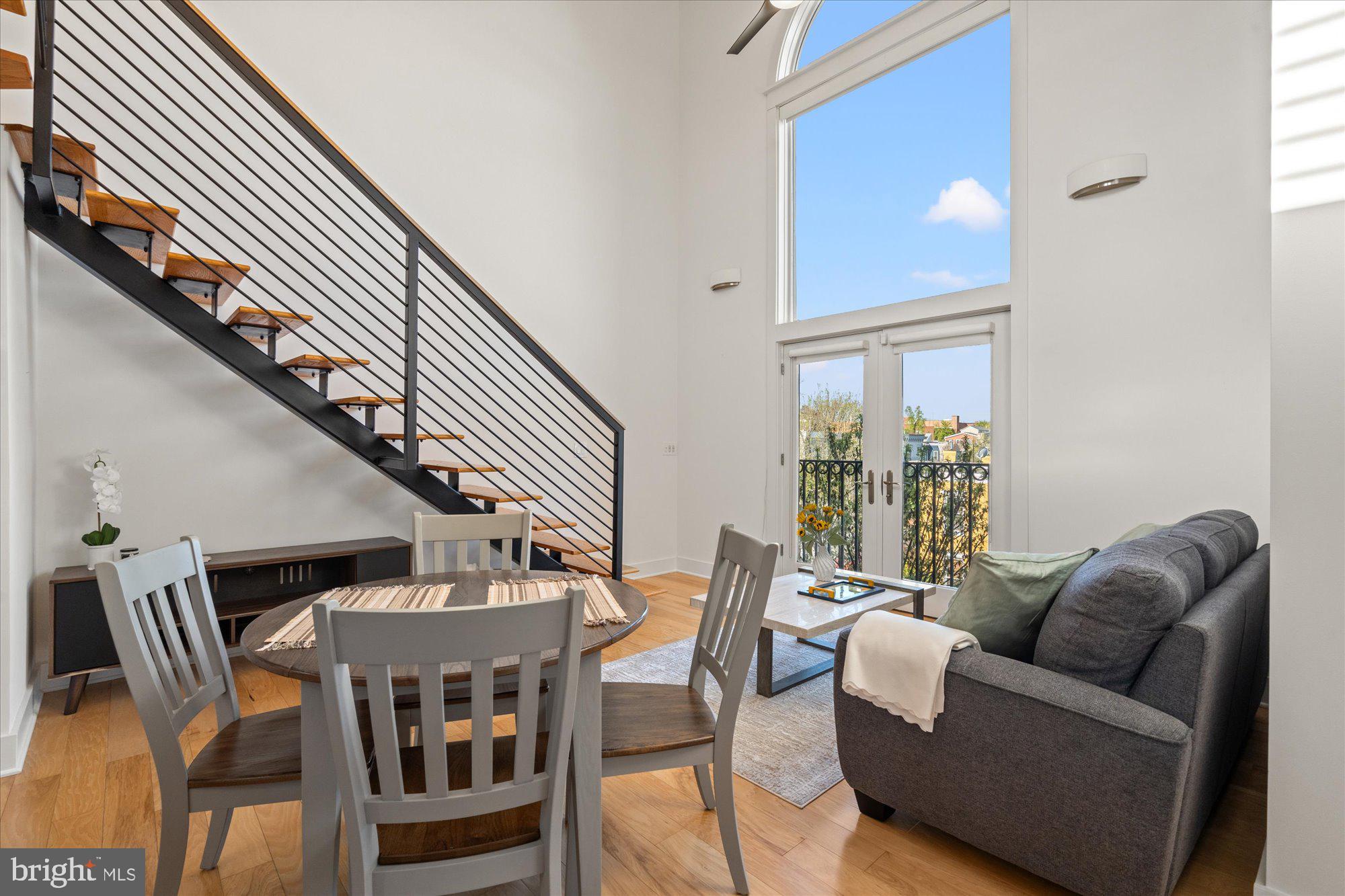 449 R Street Northwest, Unit 301 Washington, DC 20001 - Photo 11 of 37 a living room with furniture and a large window