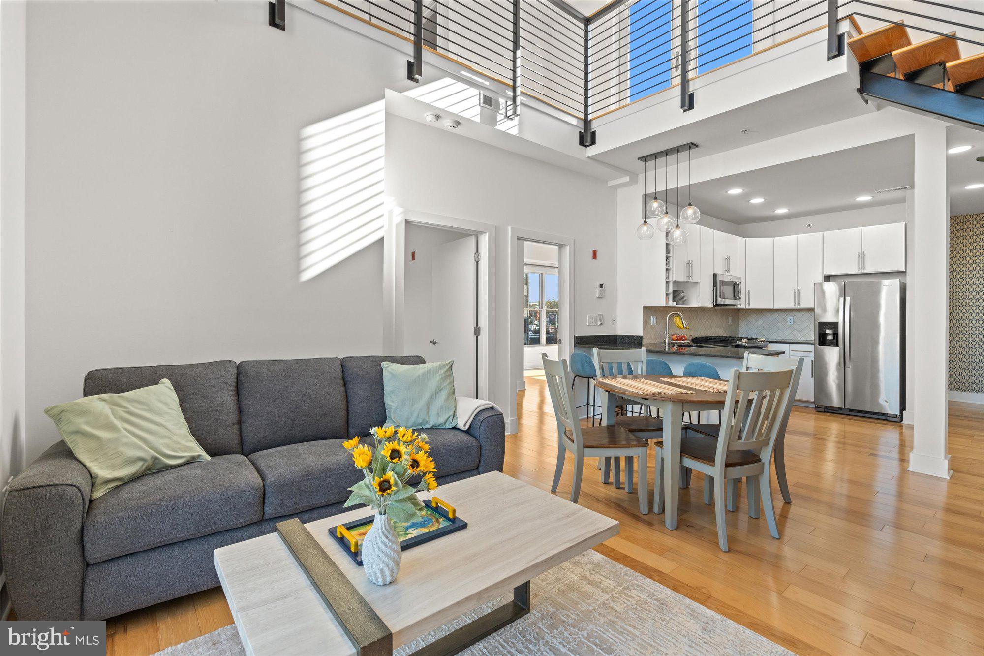449 R Street Northwest, Unit 301 Washington, DC 20001 - Photo 13 of 37 a living room with furniture and kitchen view