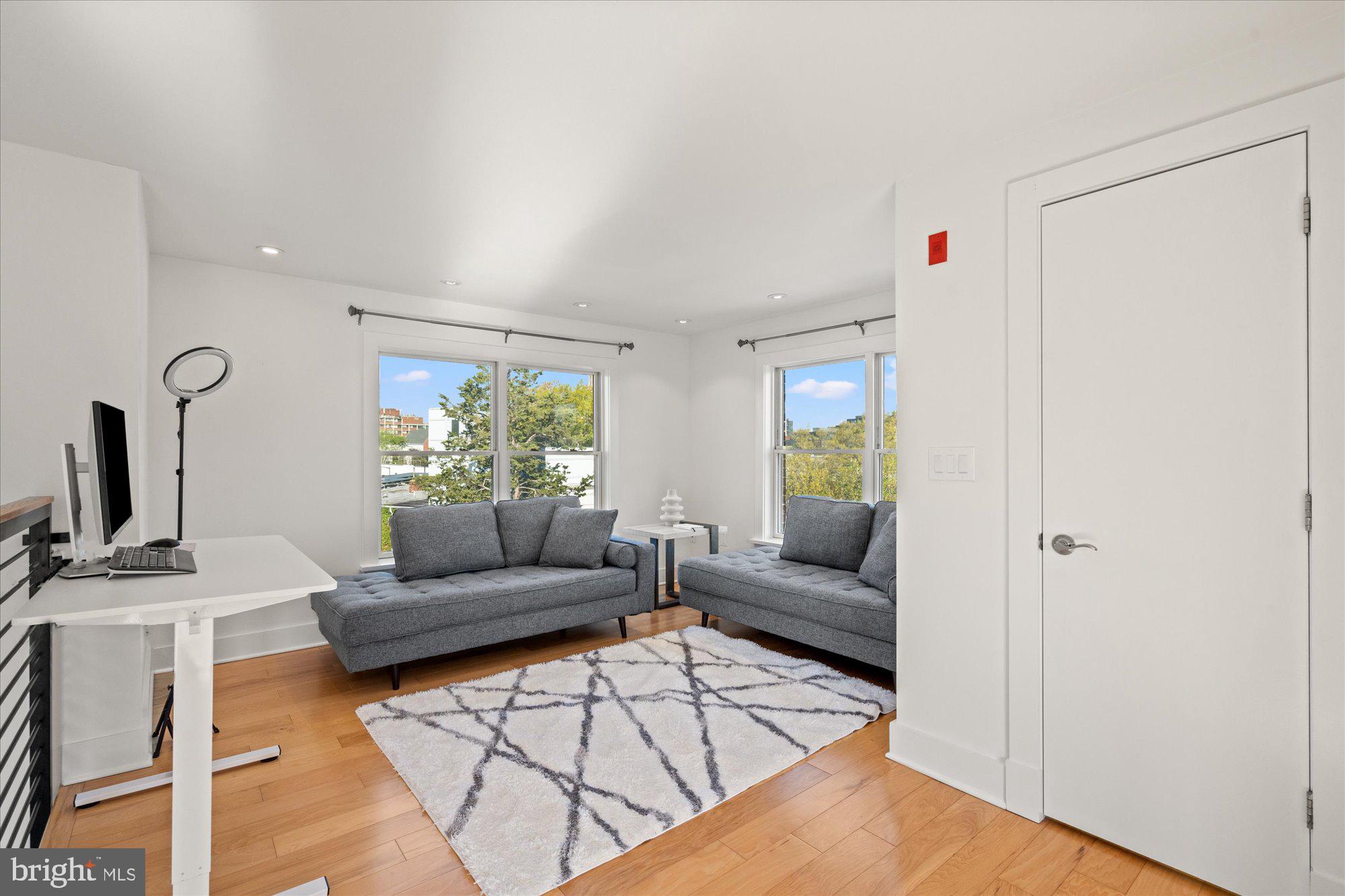 449 R Street Northwest, Unit 301 Washington, DC 20001 - Photo 23 of 37 a living room with furniture and a flat screen tv