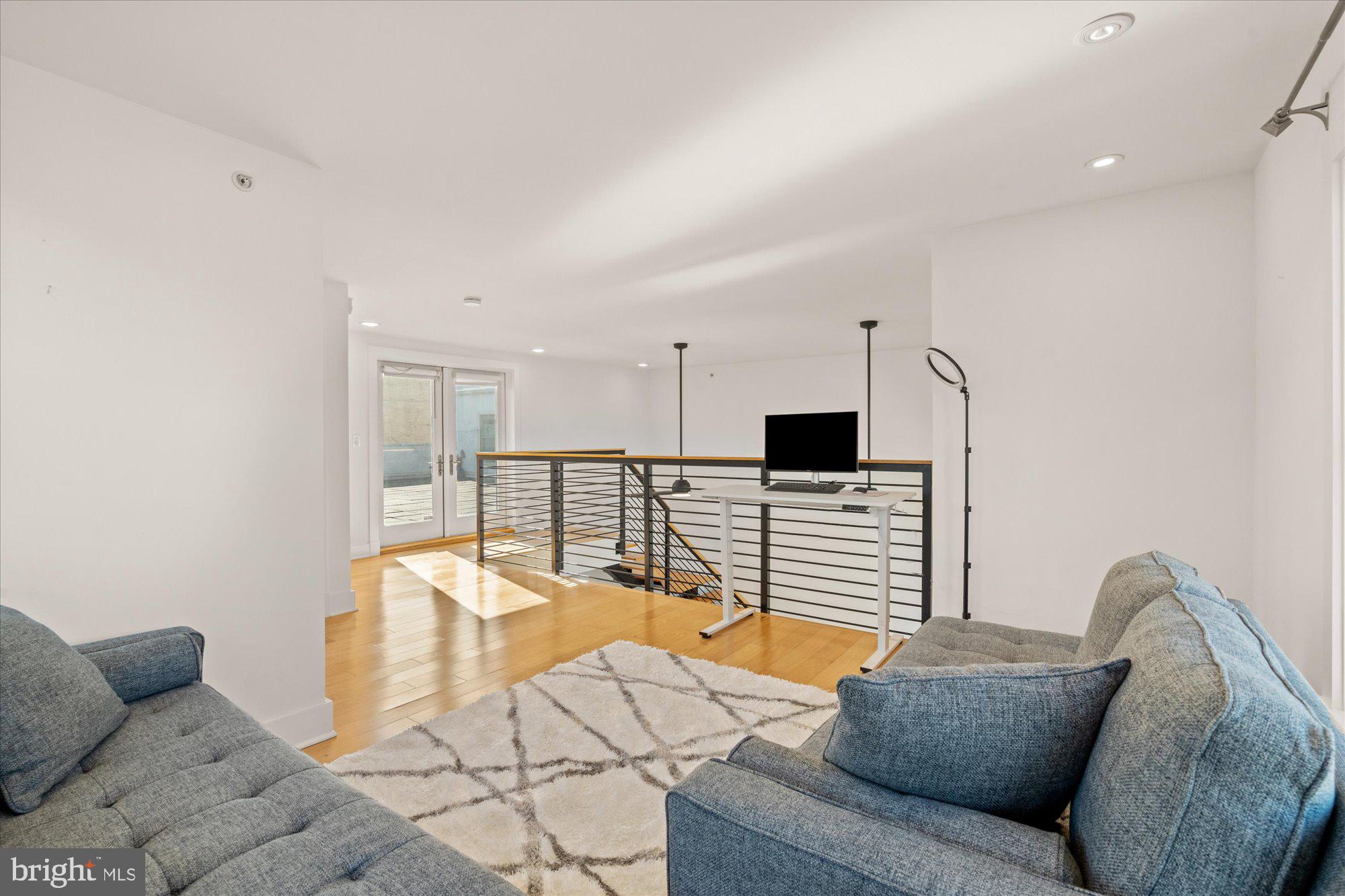 449 R Street Northwest, Unit 301 Washington, DC 20001 - Photo 24 of 37 a living room with furniture and a flat screen tv