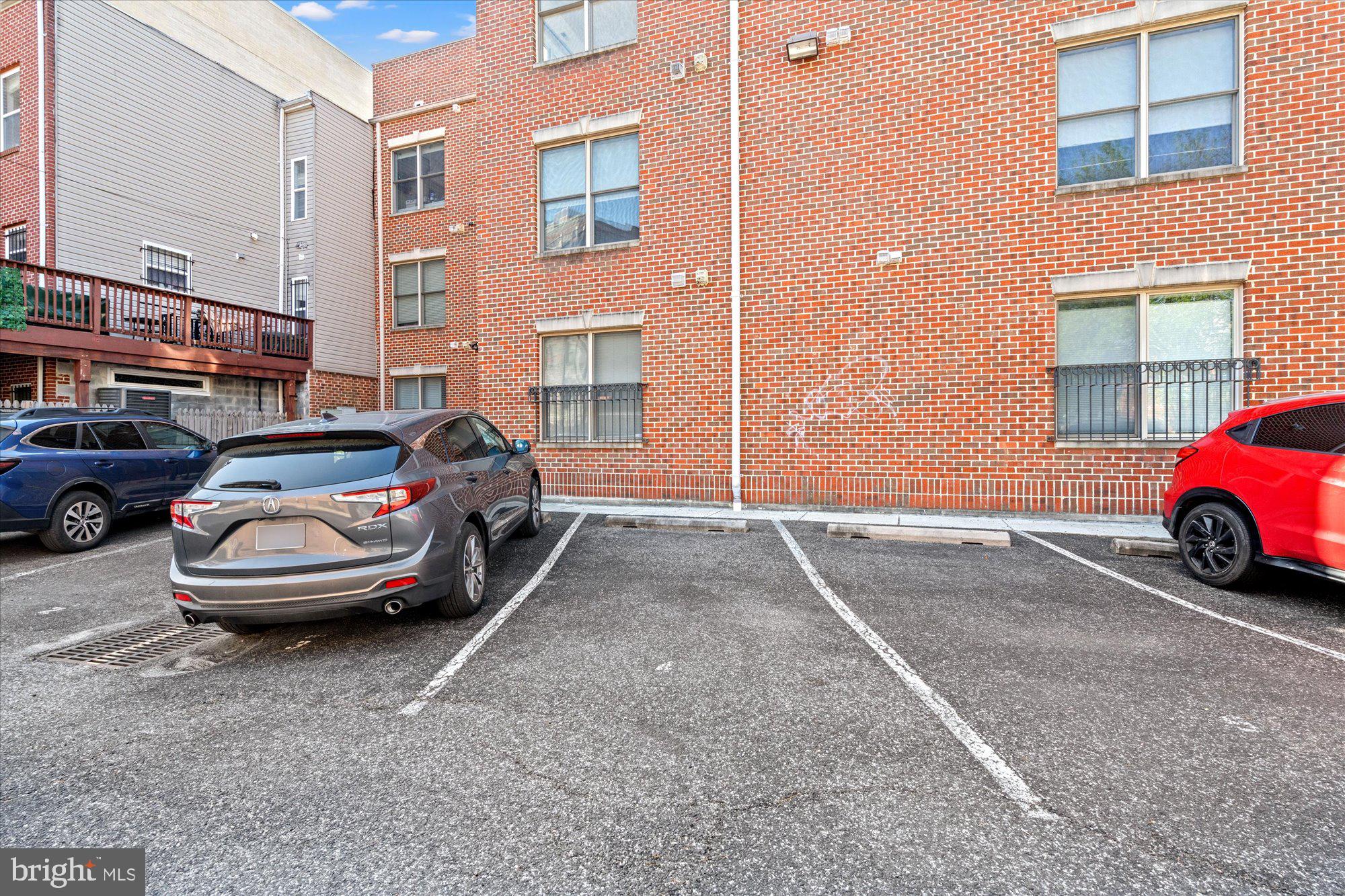 449 R Street Northwest, Unit 301 Washington, DC 20001 - Photo 29 of 37 a front view of a house with parking space