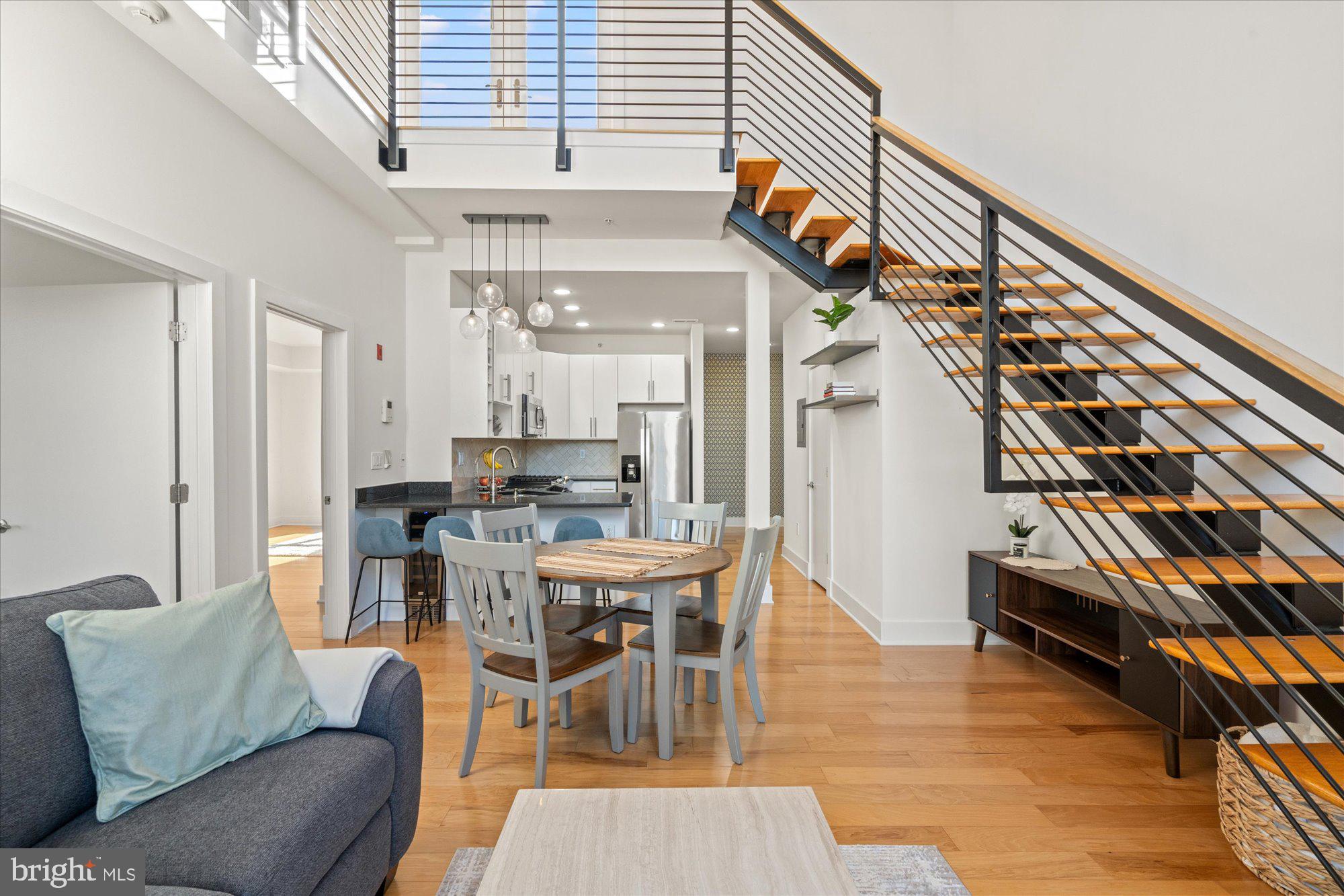449 R Street Northwest, Unit 301 Washington, DC 20001 - Photo 10 of 37 a view of a dining room with furniture and wooden floor
