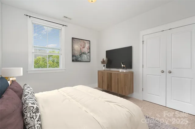 a kitchen with stainless steel appliances granite countertop a sink a stove and a wooden floors