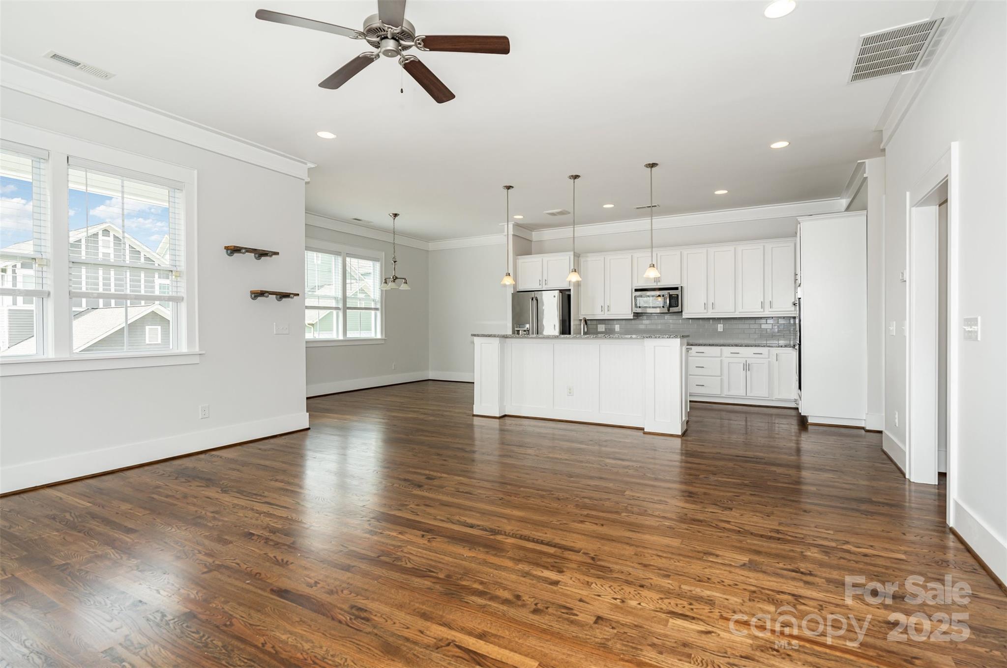 526 Spring Landing Drive Rock Hill, SC 29730 - Photo 16 of 48 a view of kitchen with wooden floor and window
