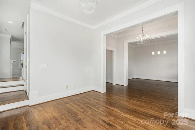 a bathroom with double vanity sink a mirror a window and vanity