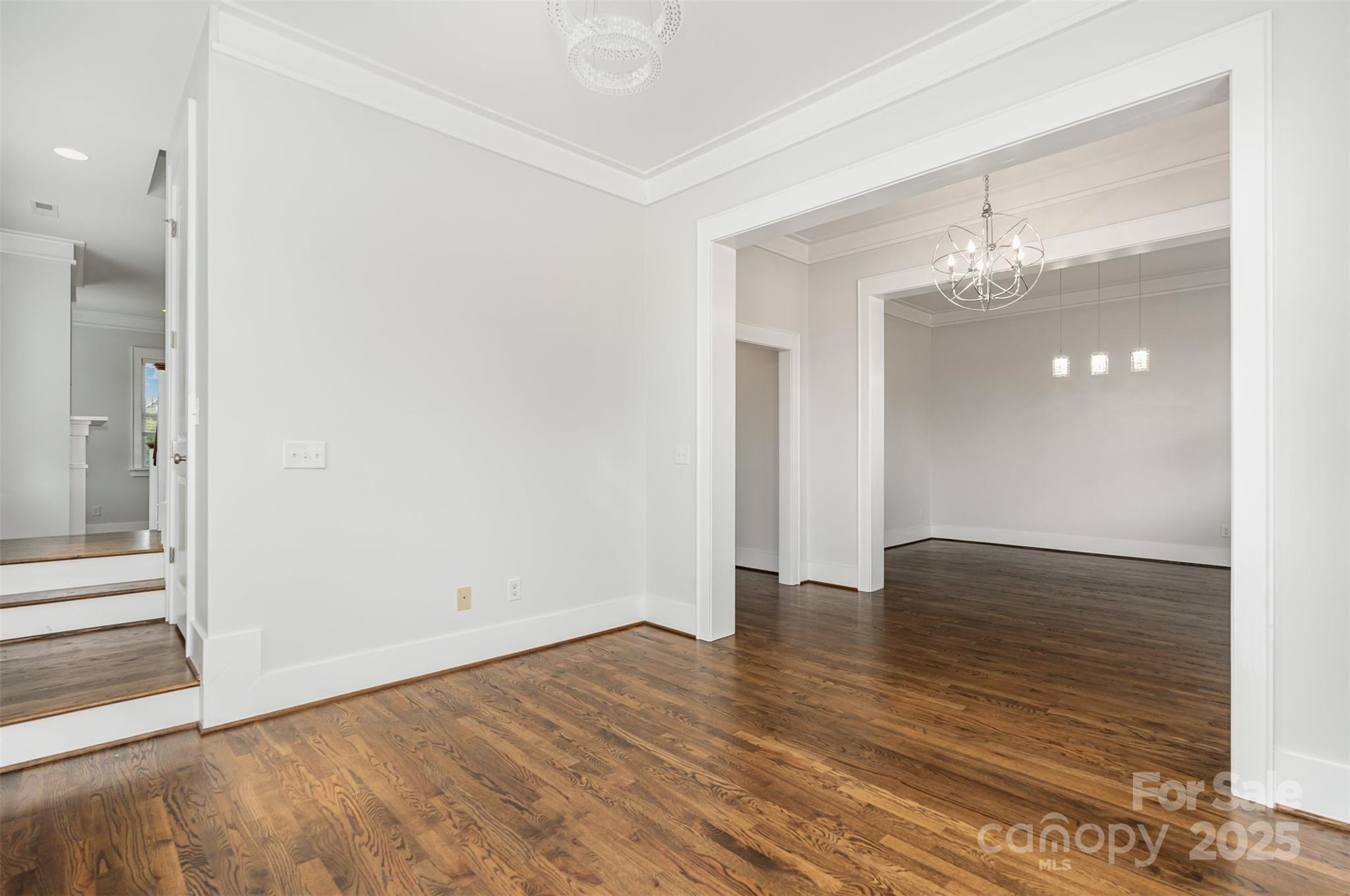 526 Spring Landing Drive Rock Hill, SC 29730 - Photo 18 of 48 a view of an empty room with wooden floor and a bathroom