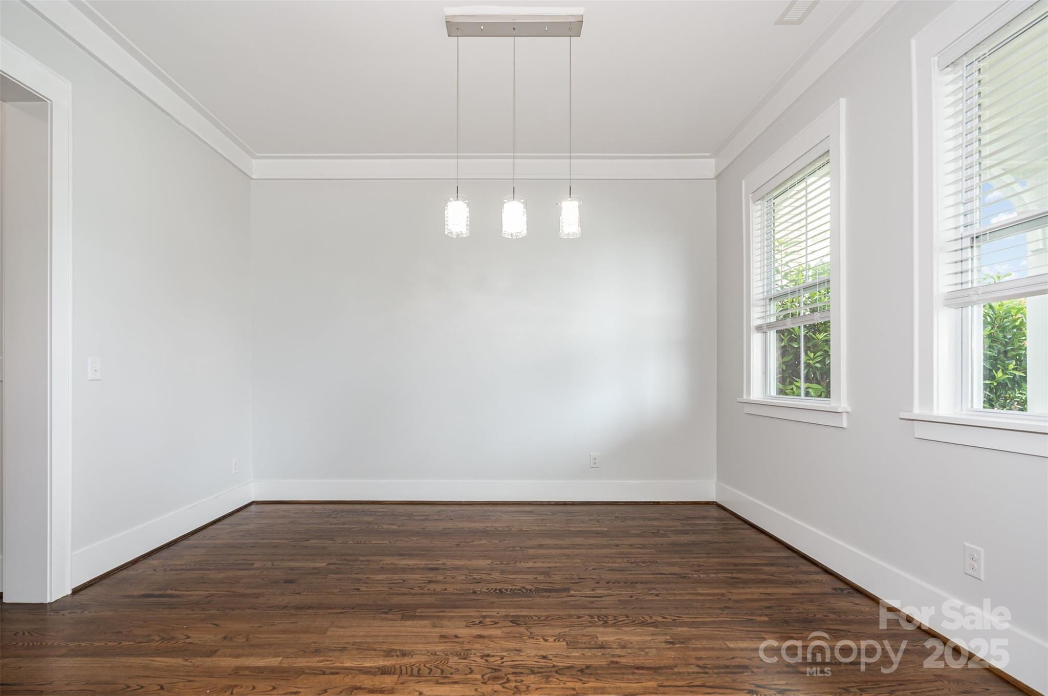 526 Spring Landing Drive Rock Hill, SC 29730 - Photo 19 of 48 a view of an empty room with wooden floor and a window
