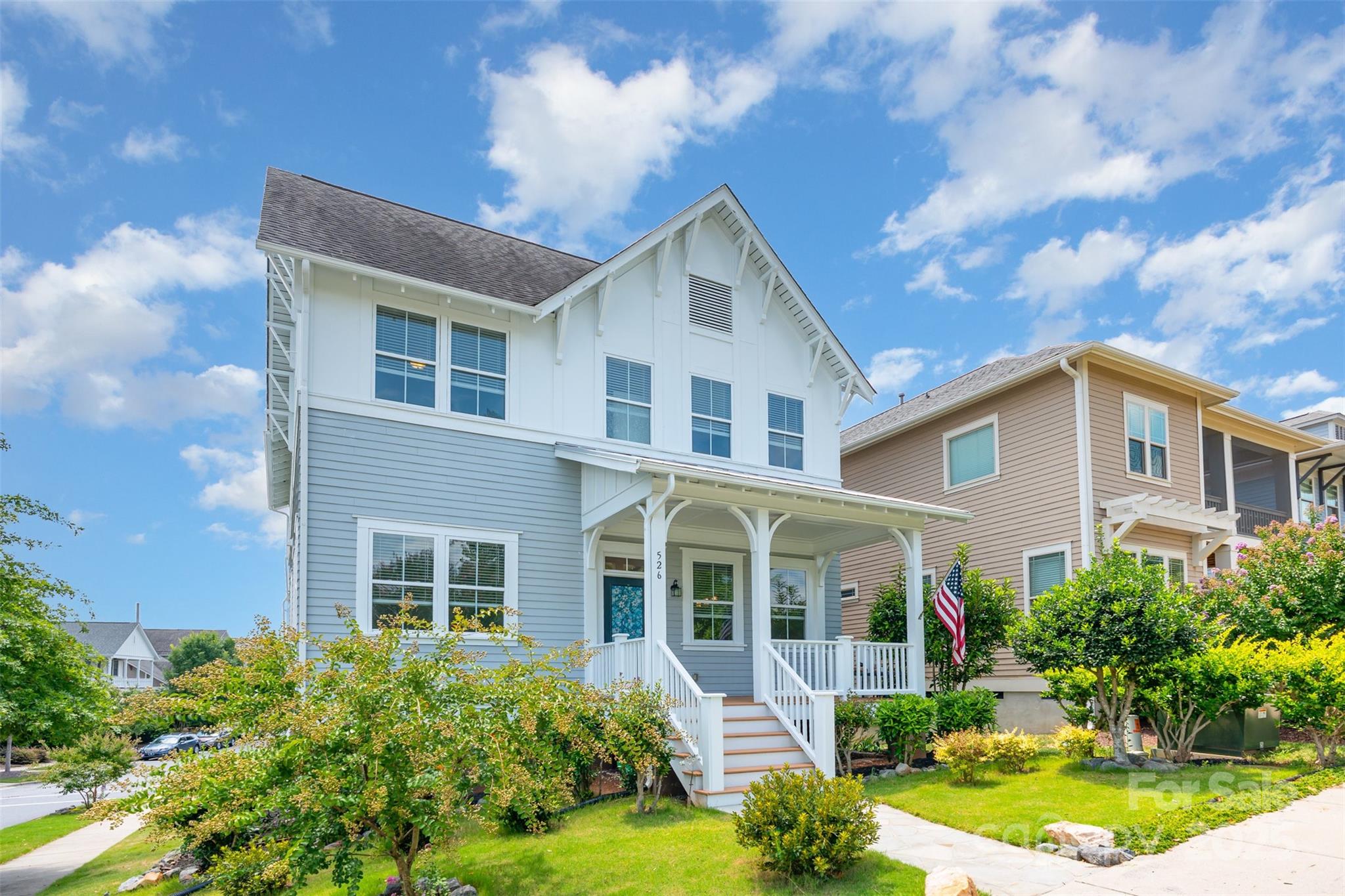 526 Spring Landing Drive Rock Hill, SC 29730 - Photo 2 of 48 a front view of a house with a yard and potted plants