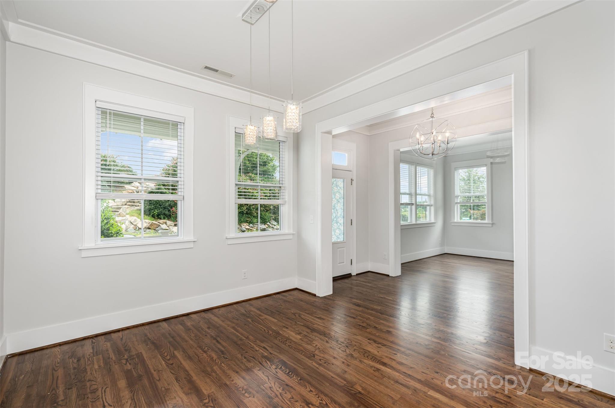 526 Spring Landing Drive Rock Hill, SC 29730 - Photo 21 of 48 a view of an empty room with wooden floor and a window