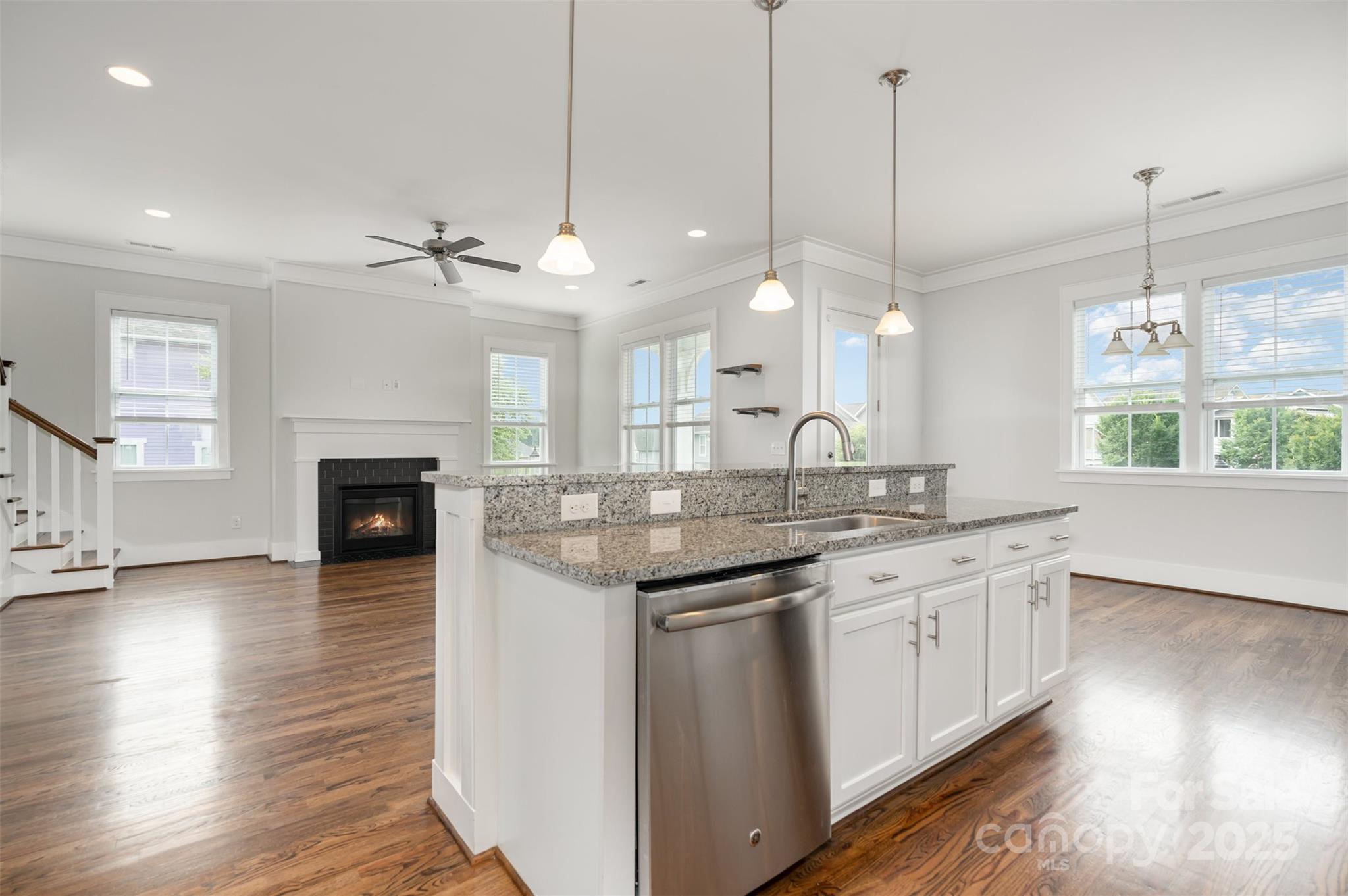 526 Spring Landing Drive Rock Hill, SC 29730 - Photo 25 of 48 a large kitchen with granite countertop a stove a sink a center island and wooden floor