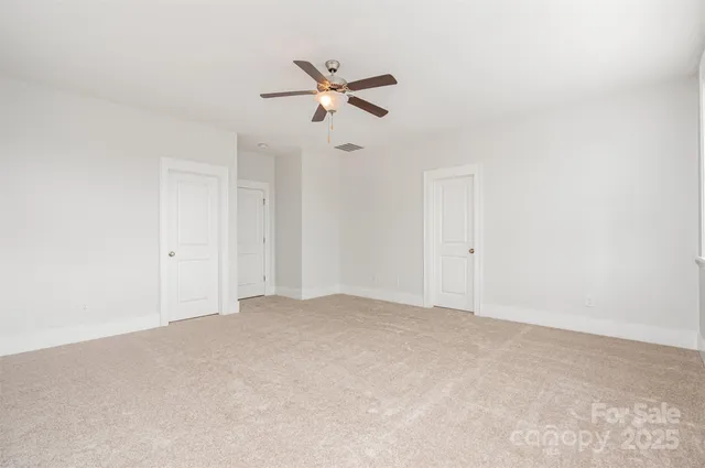 a view of a two chairs in the balcony