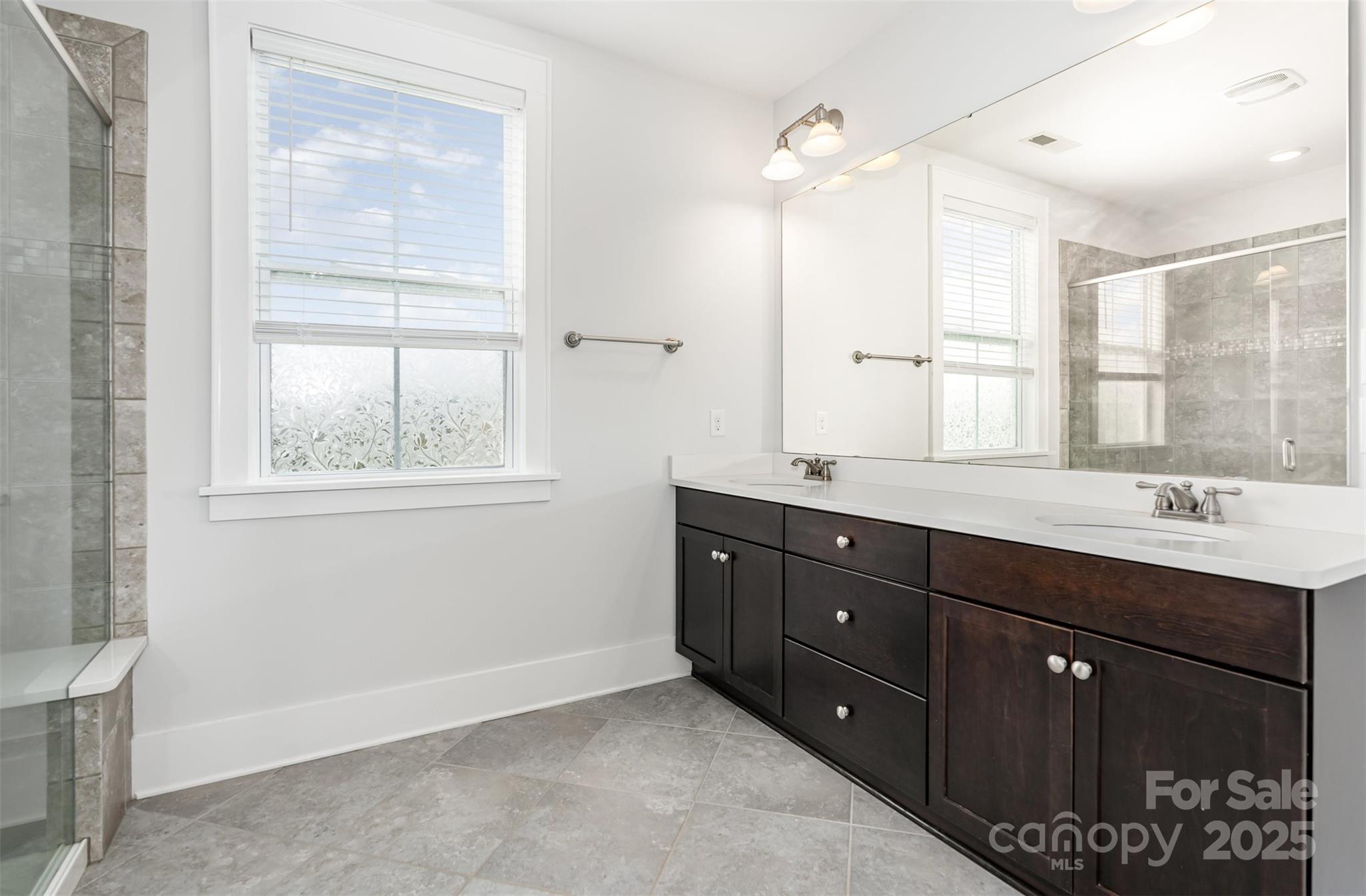526 Spring Landing Drive Rock Hill, SC 29730 - Photo 30 of 48 a bathroom with double vanity sink a mirror a window and vanity