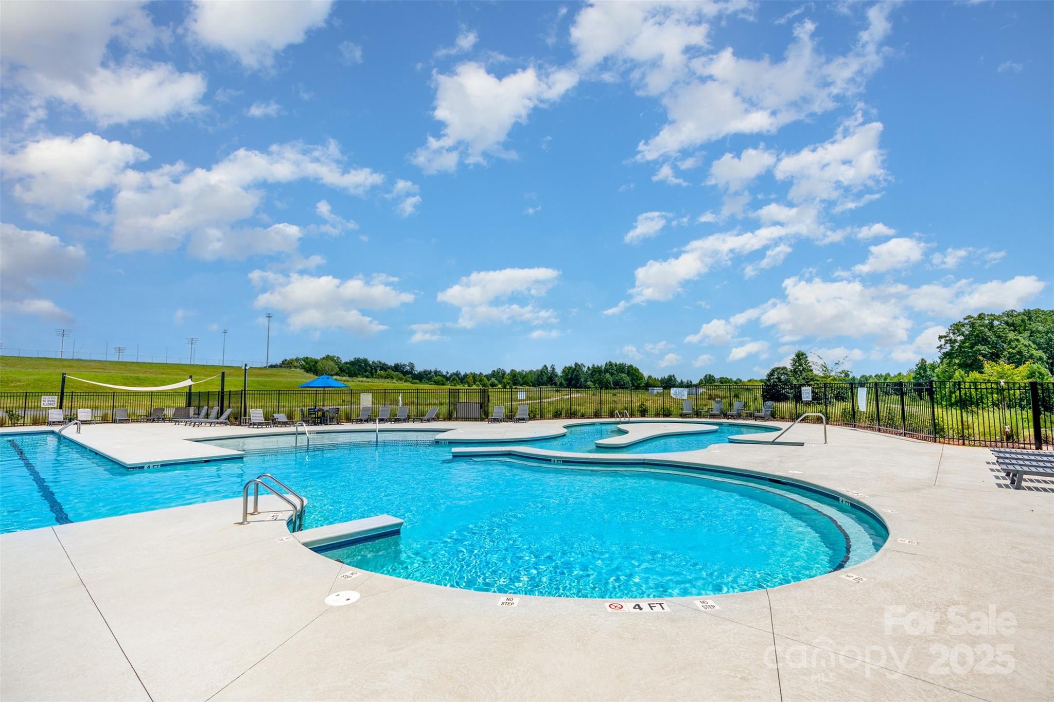 526 Spring Landing Drive Rock Hill, SC 29730 - Photo 46 of 48 a view of a swimming pool and lake