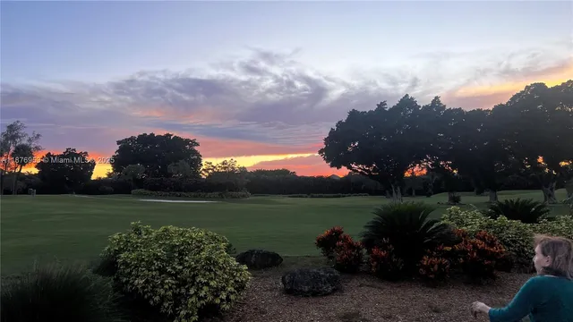 a view of a lake with a house in background