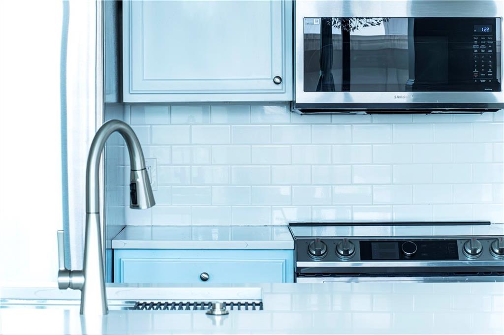 3040 Peachtree Road, Unit 1003 Atlanta, GA 30305 - Photo 12 of 42 a bathroom with a sink and a mirror