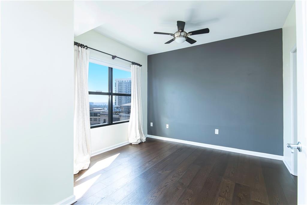 3040 Peachtree Road, Unit 1003 Atlanta, GA 30305 - Photo 18 of 42 an empty room with windows and closet
