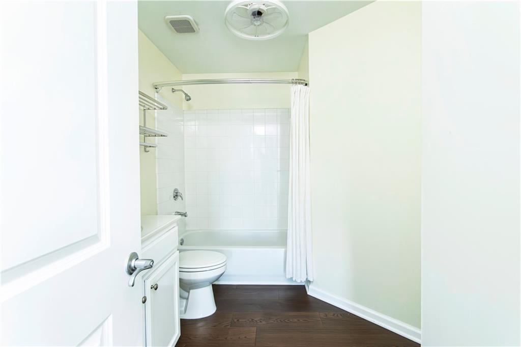 3040 Peachtree Road, Unit 1003 Atlanta, GA 30305 - Photo 20 of 42 a bathroom with a toilet and a shower