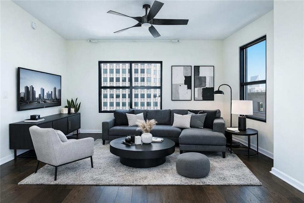 3040 Peachtree Road, Unit 1003 Atlanta, GA 30305 - Photo 2 of 42 a living room with furniture and a flat screen tv