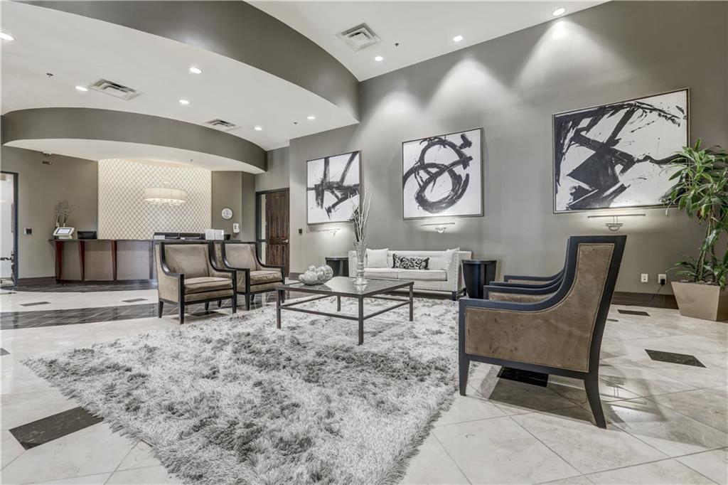 3040 Peachtree Road, Unit 1003 Atlanta, GA 30305 - Photo 29 of 42 a living room with furniture and rug