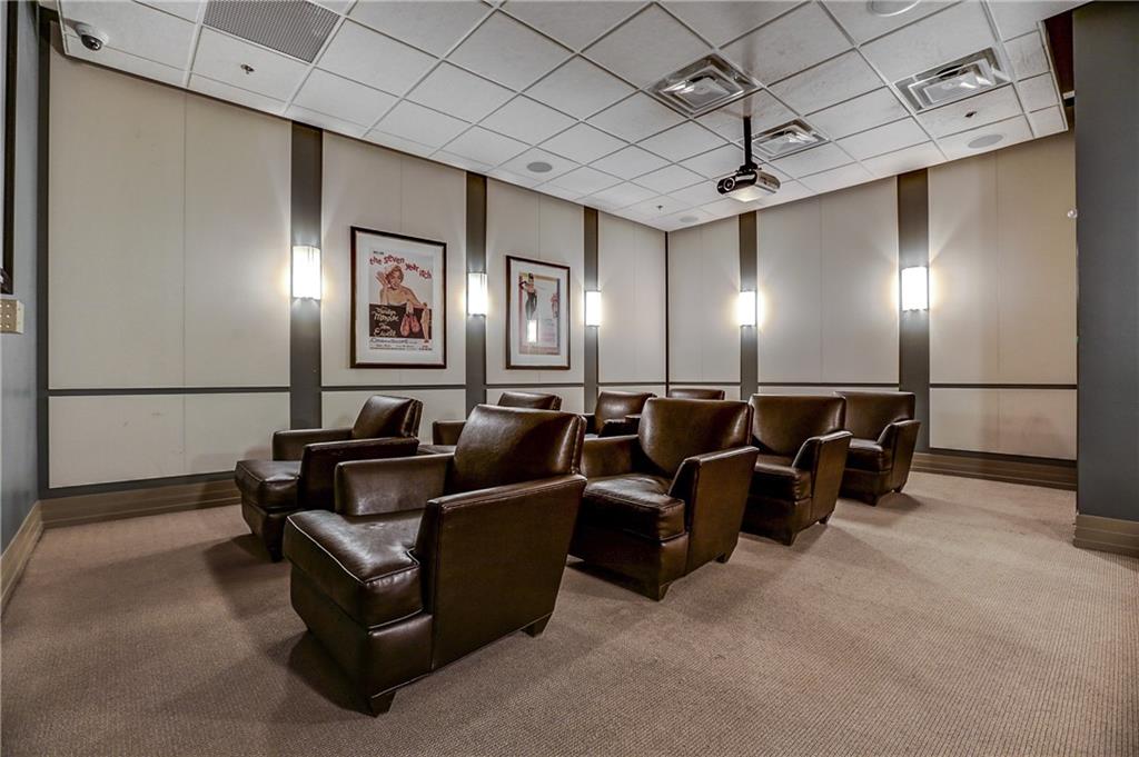 3040 Peachtree Road, Unit 1003 Atlanta, GA 30305 - Photo 30 of 42 a media room with lots of chairs and mirrors
