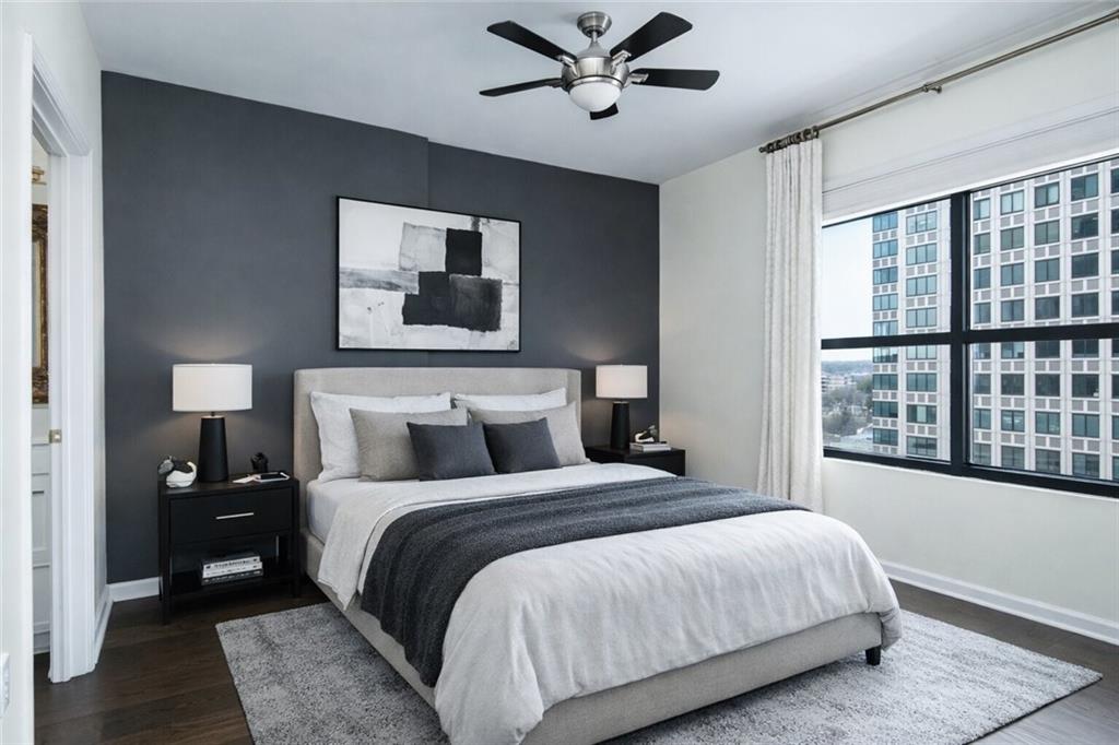 3040 Peachtree Road, Unit 1003 Atlanta, GA 30305 - Photo 3 of 42 a bedroom with a large bed and a window