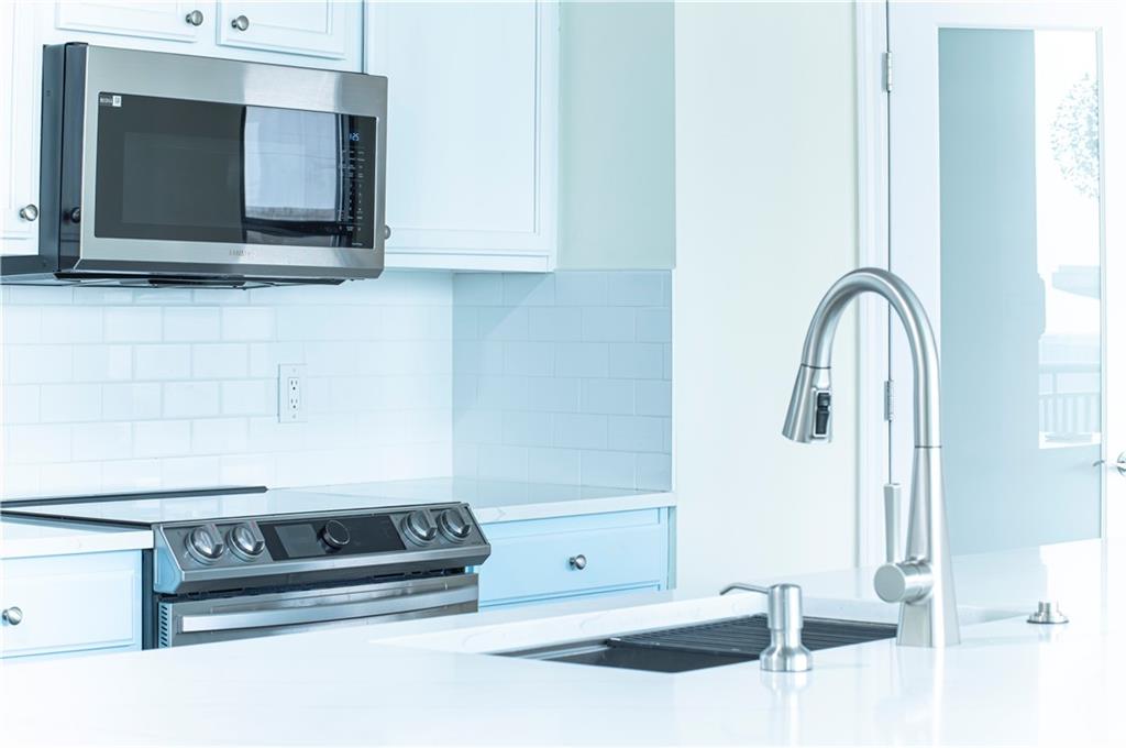 3040 Peachtree Road, Unit 1003 Atlanta, GA 30305 - Photo 10 of 42 a bathroom with a sink and a mirror