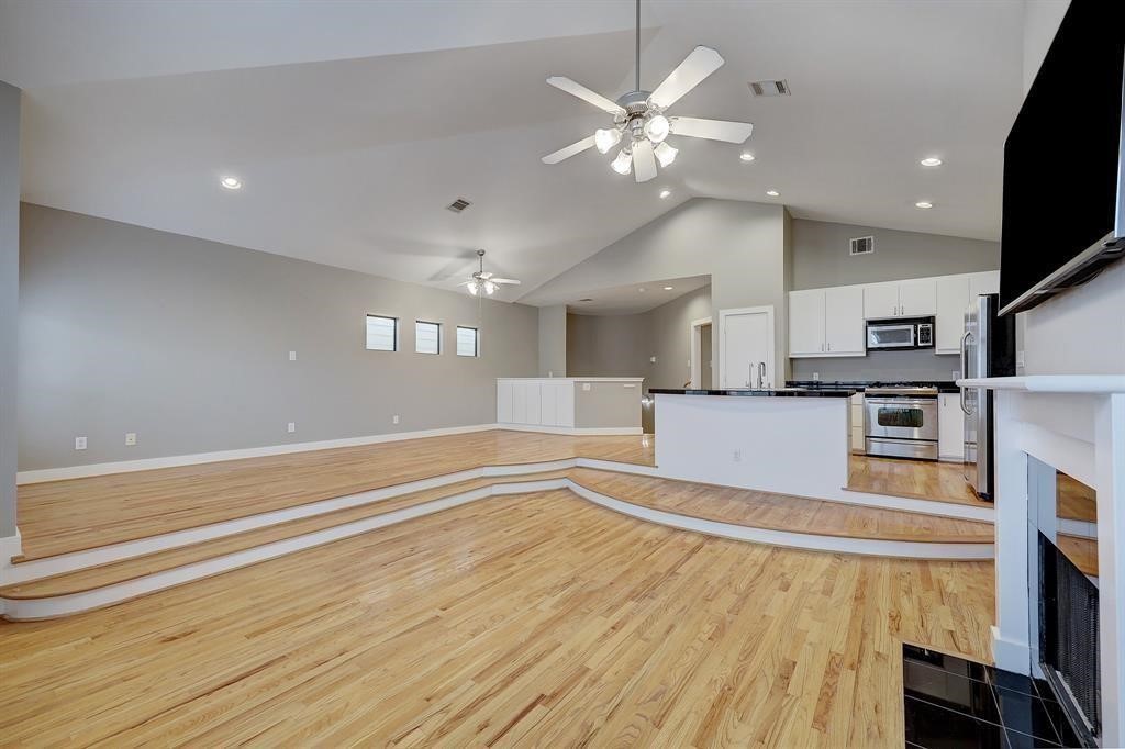 9805 Riddlelink Lane Houston, TX 77025 - Photo 2 of 12 a view of a kitchen with microwave and cabinets