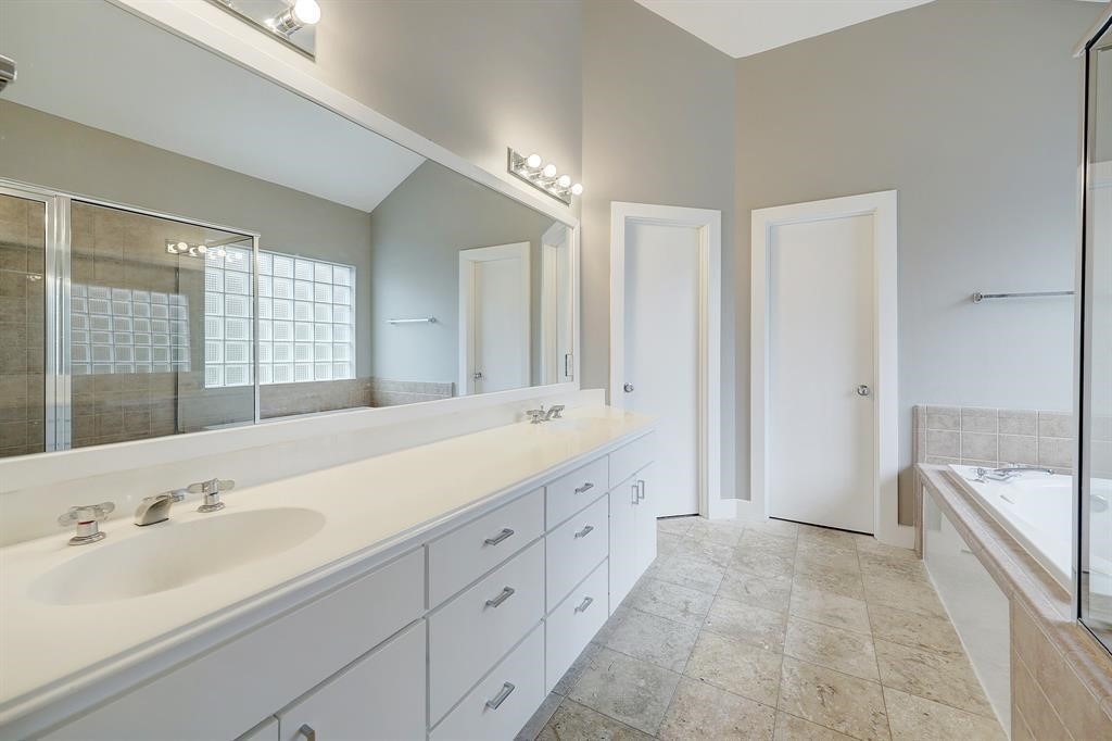9805 Riddlelink Lane Houston, TX 77025 - Photo 5 of 12 a spacious bathroom with a shower tub double and sink
