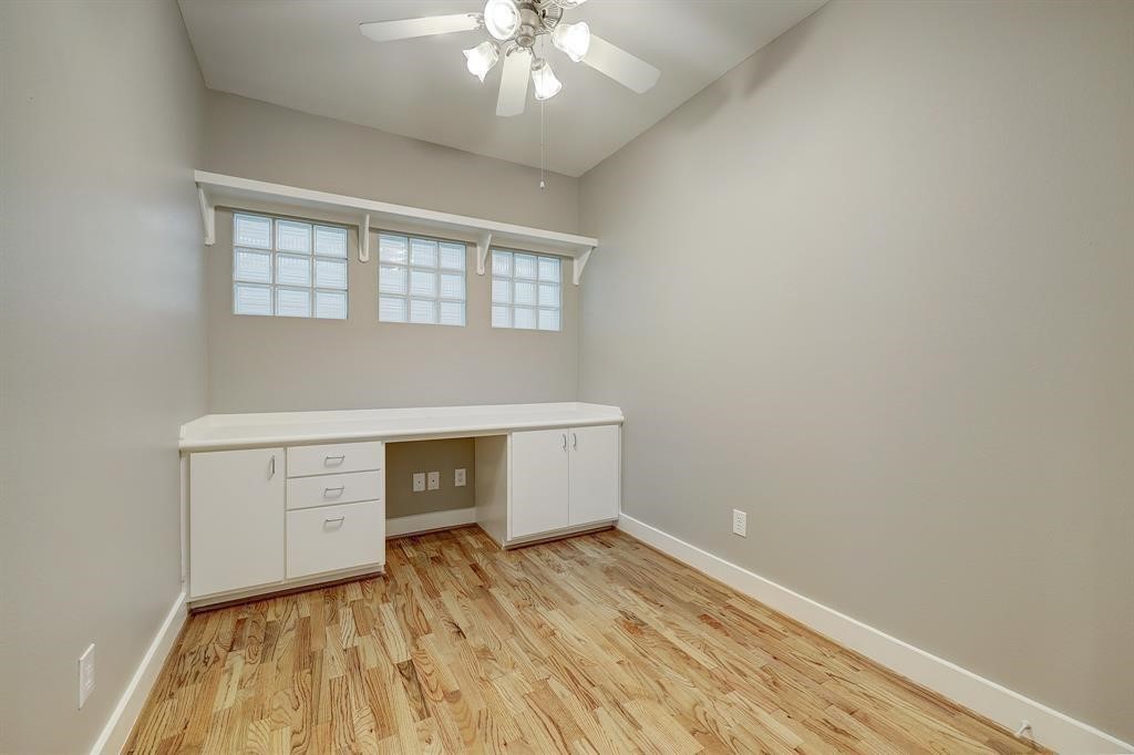 9805 Riddlelink Lane Houston, TX 77025 - Photo 10 of 12 wooden floor in an empty room with a window