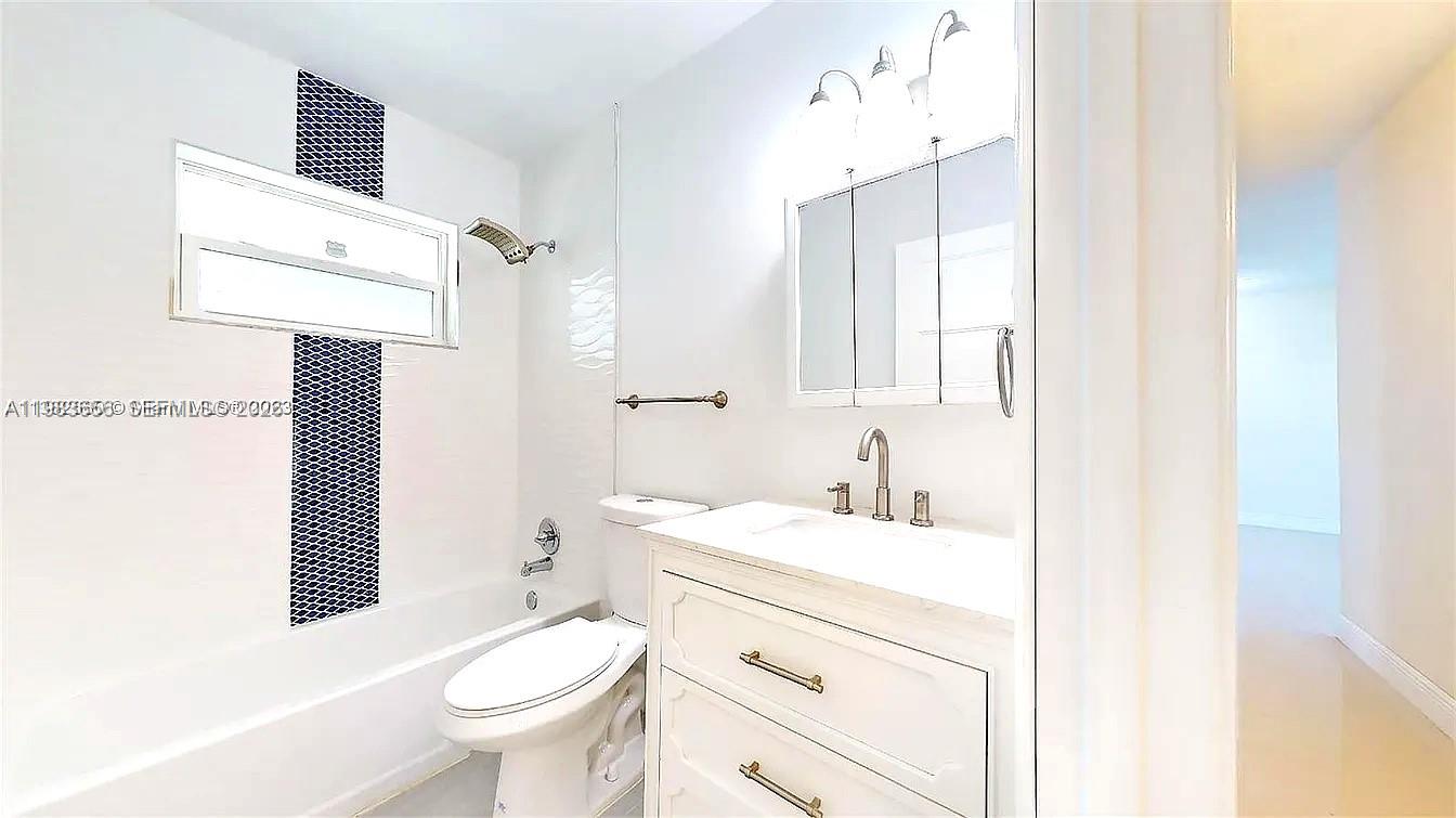 22220 Southwest 112th Avenue Miami, FL 33170 - Photo 3 of 8 a bathroom with a sink toilet vanity and shower