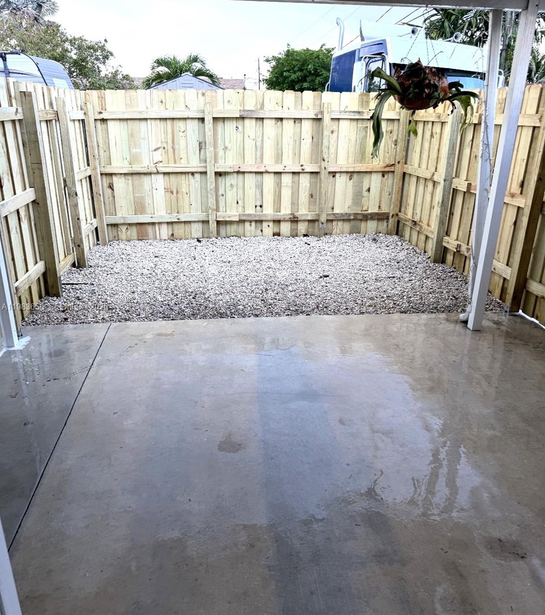 22220 Southwest 112th Avenue Miami, FL 33170 - Photo 7 of 8 a view of a wooden fence